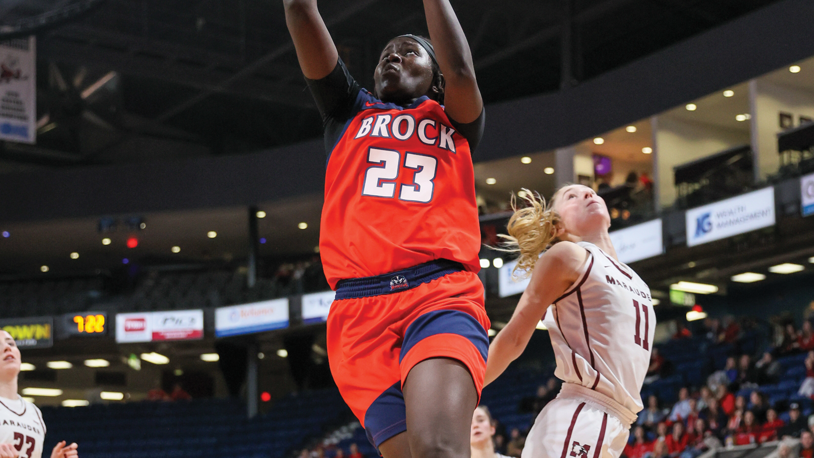 Brock women's basketball player jumping up for a layup