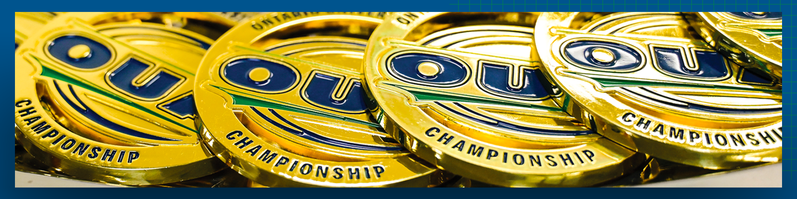 Photo of OUA Championship medals on a blue background 