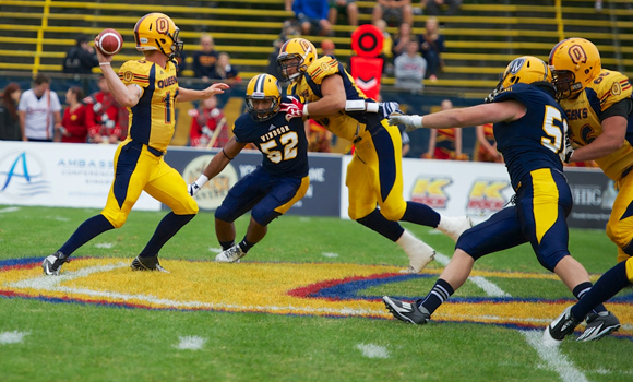 McPhee throws for three touchdowns in 49-34 win over Lancers