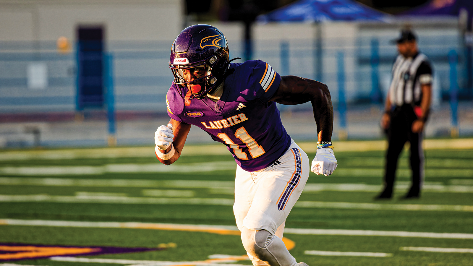 Action photo of a Laurier football player running 