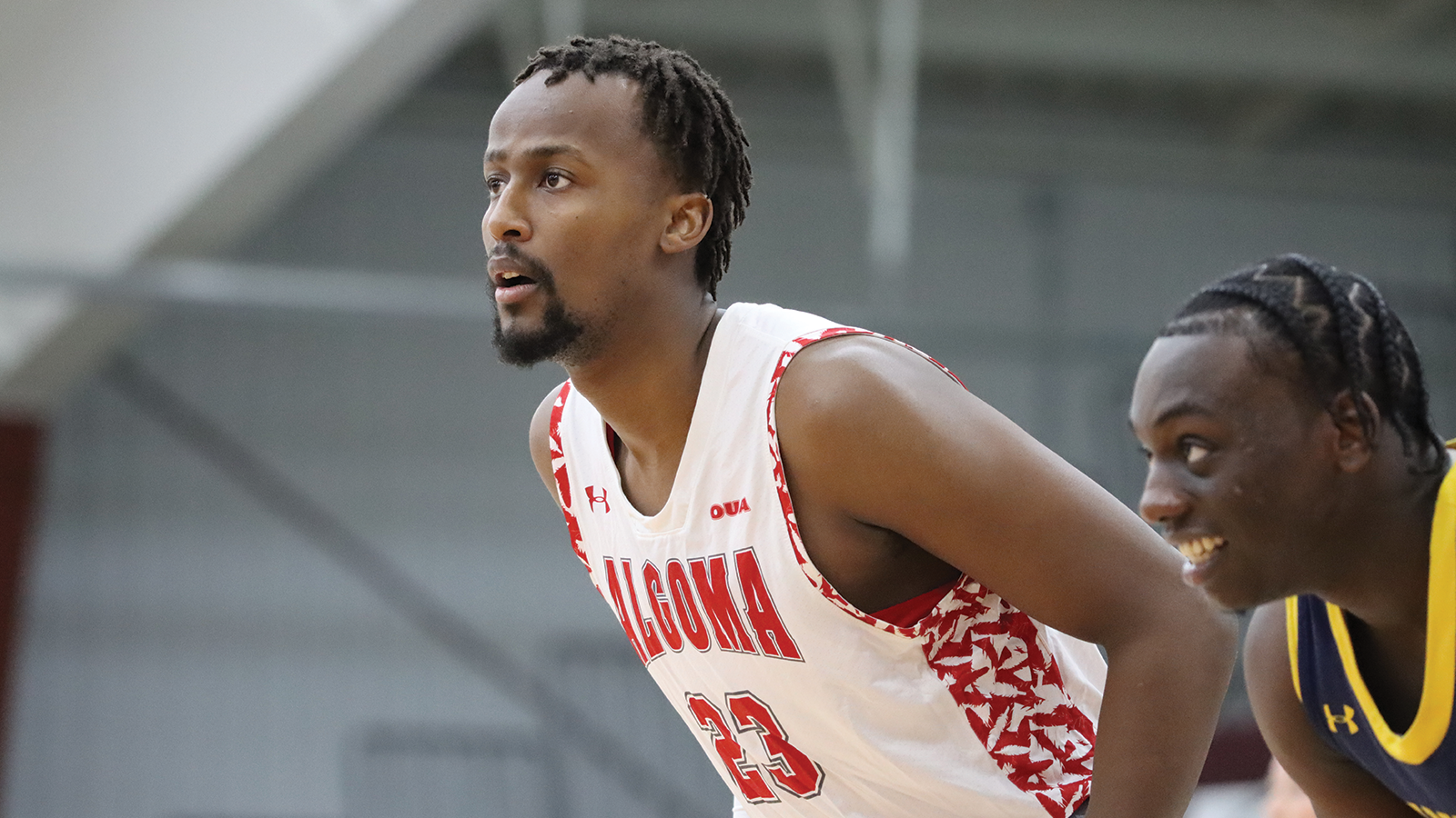 Action photo of Algoma Thunderbirds men's basketball player 