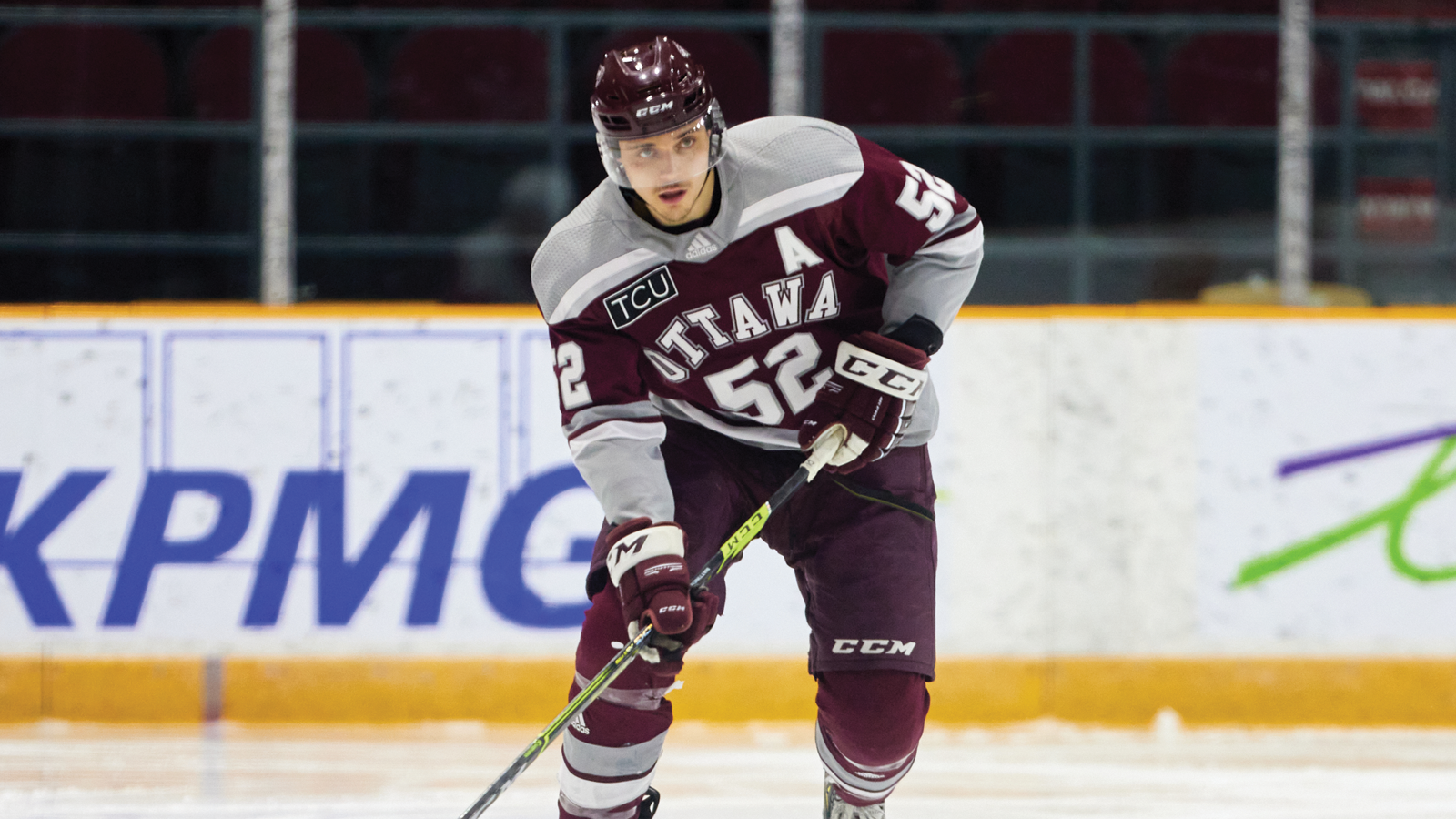 Former Ottawa Gee-Gees hockey player Nicolas Mattinen skating up the ice with the puck during a game
