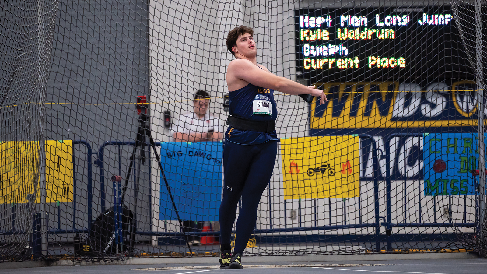 Action photo of a Windsor Lancers weight throw athlete 
