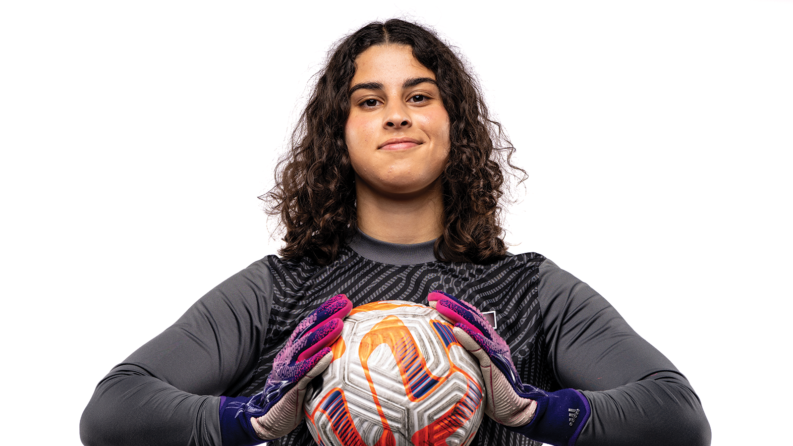 Photo of McMaster Marauders Jenine Alkhatib posing with a soccer ball